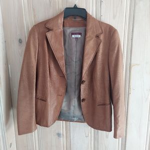 Escada leather jacket runs a bit smaller than I would expect from a size 40